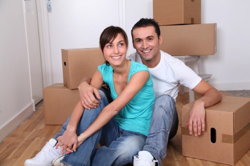 Professional movers handling furniture in Finchley